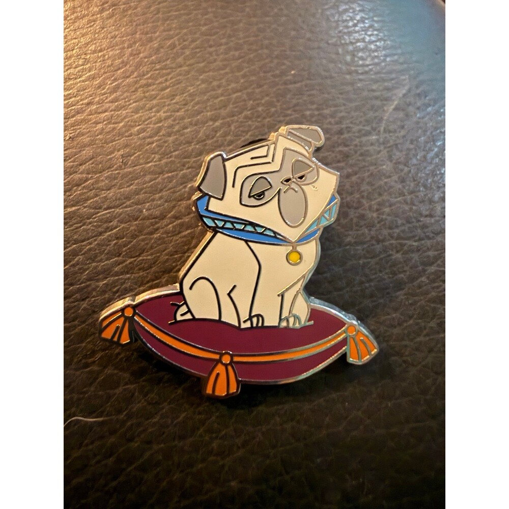 Disney villains sidekicks booster pin Percy from Pocahontas on a pillow